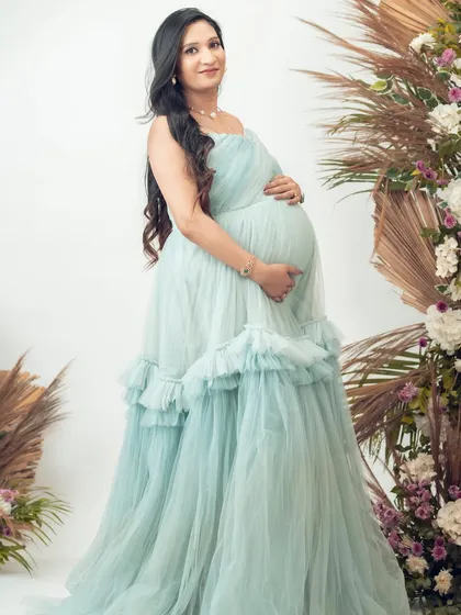 A full-length view of our Eva gown. The delicate, layered tulle and strapless design are perfect for a fairytale-themed shoot.
