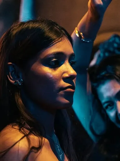A cinematic close-up of a woman enjoying the vibe.