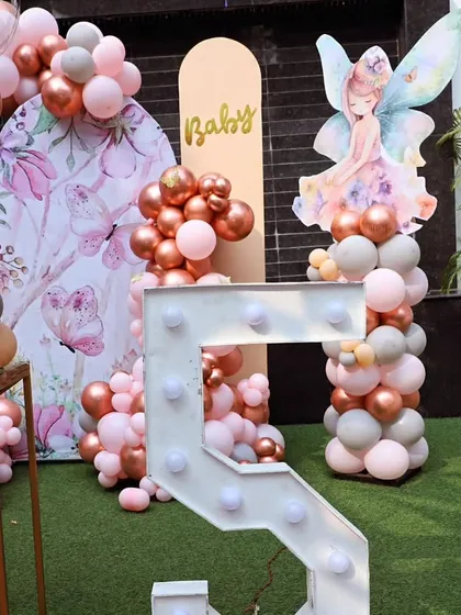 A close-up of the large, illuminated number '5' and the enchanting fairy character, perfect for a fifth birthday celebration.