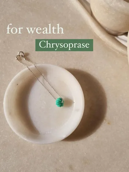 My chrysoprase melon charm, a stone I use to attract wealth. Chrysoprase also promotes love of truth and stimulates creativity.