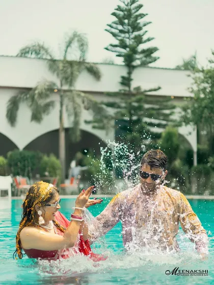 The pure, uninhibited joy of a Haldi ceremony, captured as the couple playfully splashes in a pool. I believe in capturing the real fun, those unscripted moments that become the best memories.