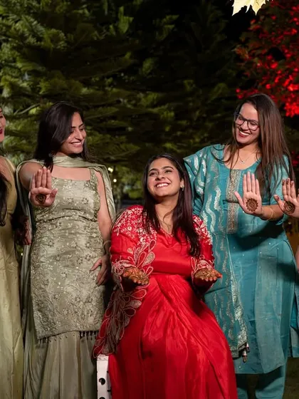 The bride and her bridesmaids showing off their henna-adorned hands. A must-have shot for every Mehandi album.