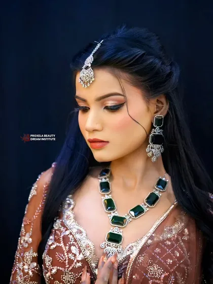 This look is about feeling unstoppable. The makeup features a subtle smokey eye and a neutral lip, creating a powerful yet understated glam vibe.
