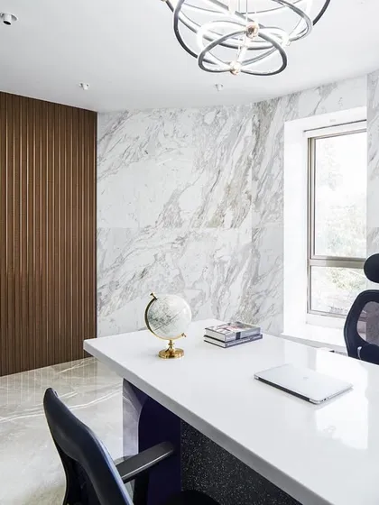 A director's cabin should feel both powerful and personal. For the 'Greywood Loft', I combined a sleek white desk with a backdrop of rich wood paneling and textured marble walls to create a space of sophisticated authority.