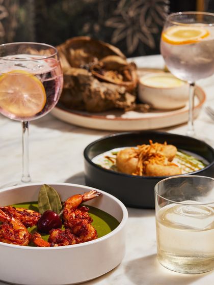 A beautiful spread from our pop-up at Sheraton Grand Bangalore. Savoury prawns in a green curry, dahi vada, and more, all paired with our signature cocktails.