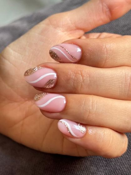 A close-up of the swirl pattern on short, round nails.