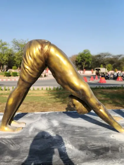 This life-size statue is part of a Surya Namaskar series, finished in a classic gold metallic look. We craft these dynamic yoga pose sculptures for gardens, wellness centers, and public parks, creating a sense of peace and movement.