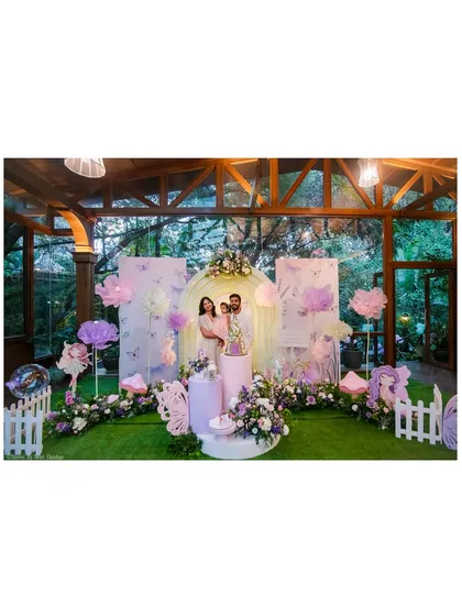 A glimpse into a magical fairy-themed first birthday we designed. The setup includes a custom-arched backdrop, pastel butterfly and floral details, and a beautifully styled cake display, all coming together to create an enchanting garden atmosphere.