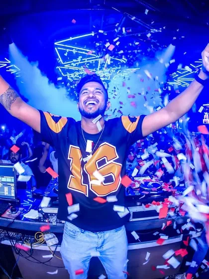 Pure joy and celebration. This is the peak of the night, with hands in the air and confetti everywhere, creating an unforgettable moment at Club Illusions.