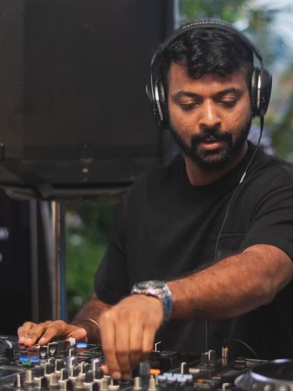 Adjusting the levels, completely focused on the sound. Technical skill is the foundation of a great set.