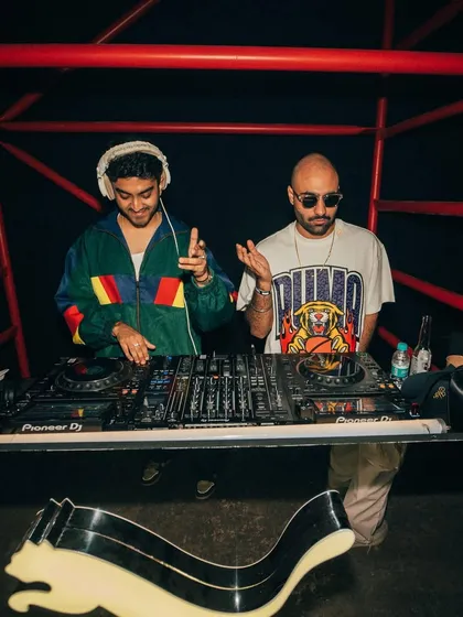 Spinning alongside a fellow artist at a high-energy event for Puma. The red lighting and prominent logo created a bold, dynamic atmosphere for the night.