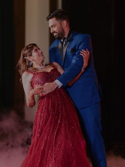 A romantic dip on the dance floor, surrounded by a haze of smoke that adds to the magic.