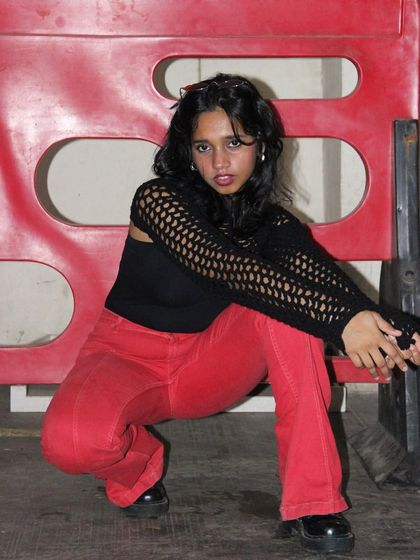 Another shot of the black mesh bolero shrug. The open-stitch design is lightweight and breathable, making it a great accessory for any season.