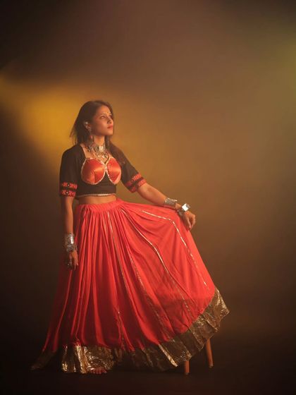 A festive portrait for Navratri. The warm, smoky lighting and traditional attire create a celebratory mood, capturing the elegance and anticipation of the festival.
