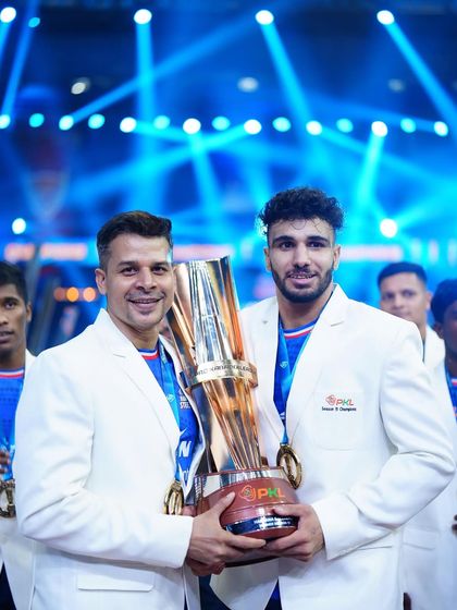 Standing with a champion. A proud moment holding the PKL trophy with one of our key players, showcasing the success that comes from dedication and a scientific approach to training.