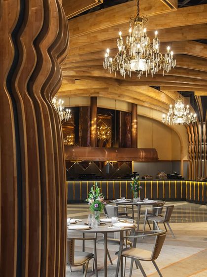 The Heritage Vault, our project in Kolkata, redefines banquet hall design by merging European influences with Indian architectural heritage. This view shows the main dining area, with its handcrafted chandeliers and modern-classic furniture.