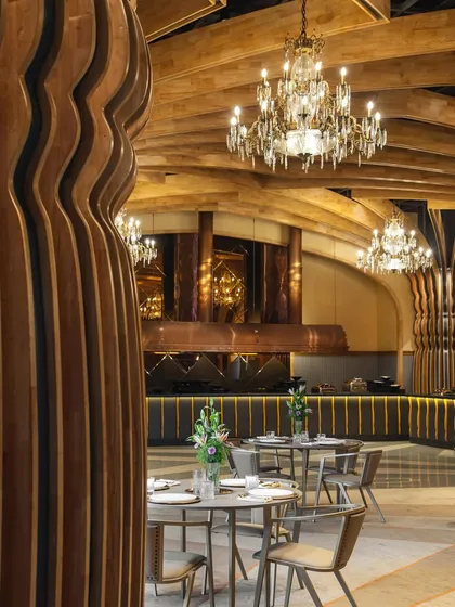 The Heritage Vault, our project in Kolkata, redefines banquet hall design by merging European influences with Indian architectural heritage. This view shows the main dining area, with its handcrafted chandeliers and modern-classic furniture.