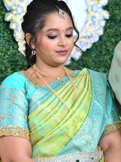 Jebha's engagement glam! A beautiful look with a light blue and green saree, paired with diamond jewelry.