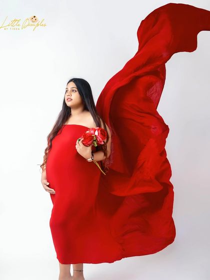 Feeling bold and confident in red. I love using flowing fabrics to add drama and movement to my studio portraits, making you feel like a star.