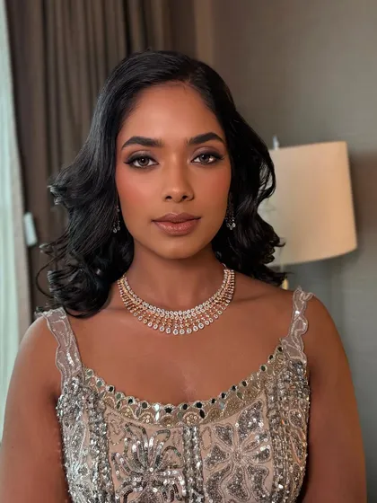 A goddess glow for this reception bride. I love working with dusky skin tones, creating a luminous, bronzed look that highlights the skin's natural richness.