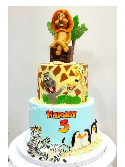 A repeat design of the popular Madagascar cake. This one also survived a trip in heavy rains, arriving perfectly, which is a testament to how I build my cakes.
