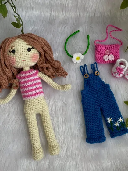 One of the best parts of my dolls is that you can play dress-up! This doll comes with a full set of removable clothes, including overalls, shoes, and even a little handbag and hairband. It makes for hours of fun and imaginative play for children.