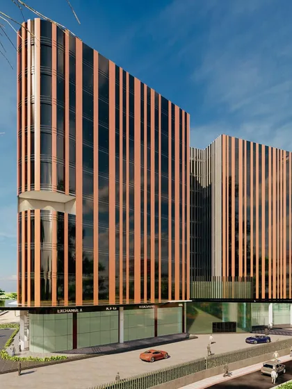 Our design for a Grade A business building employing solar passive architecture. The vertical louvers are a key feature, designed not just for aesthetics but to strategically manage solar heat gain and maximize natural light within the office spaces.