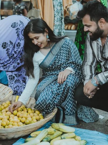 A unique pre-wedding concept shoot in a bustling local market. We love telling stories that are personal and unconventional, like this candid moment of the couple shopping for lemons.
