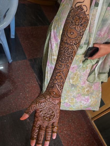 A full-arm view of Bride Rumana's mehendi. The design is a beautiful mix of floral and traditional patterns.
