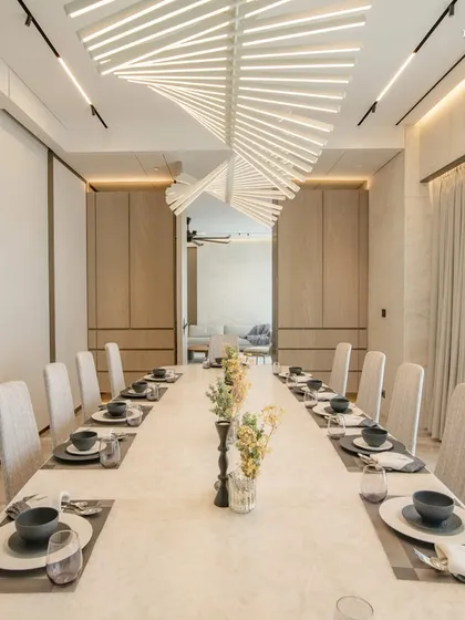 This uber-luxury apartment redefines dining elegance with a serene and exclusive dining room. Framed by expansive sea views, the space features the sleek minimalism of Giorgetti dining chairs and the subtle grandeur of Vibia rhythm lights, balancing contemporary style with timeless comfort.