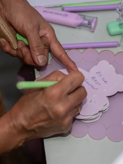 A guest writing a sweet message for the baby, a beautiful keepsake for the parents-to-be.
