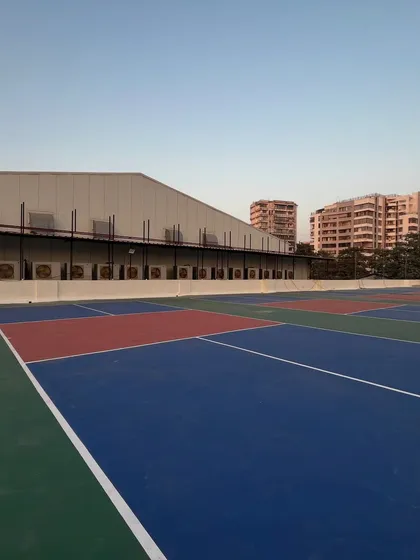 A clear daytime view of the multiple courts at my Vile Parle facility. You can see the clean lines and high-quality surface that ensures a great game every time.