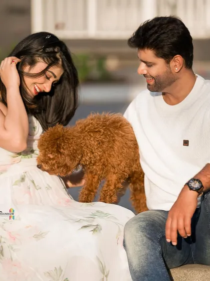 A sweet moment as the couple's poodle joins the maternity shoot. I believe pets are family and love including them in these special memories.