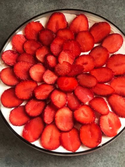 Making the most of strawberry season with my winter trifle. This dessert is topped with a beautiful arrangement of sliced fresh strawberries.