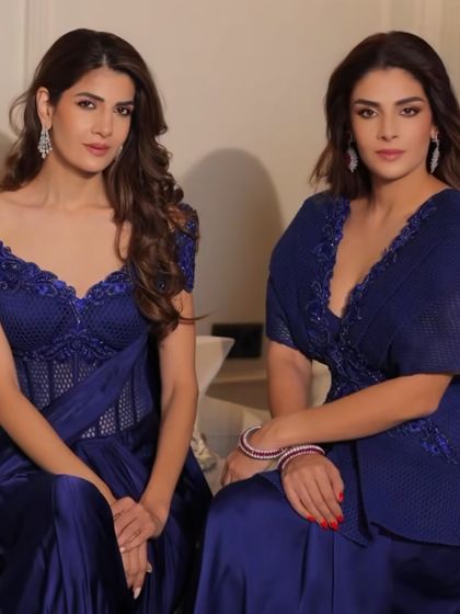 A study in contrasts, with two models showcasing my designs in electric blue and elegant ivory.
