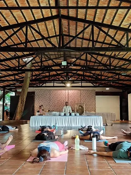 A moment of deep relaxation during a large group sound bath at a wellness retreat. My training equips you to hold space and facilitate these powerful healing experiences for groups of any size, creating a collective field of peace and tranquility.