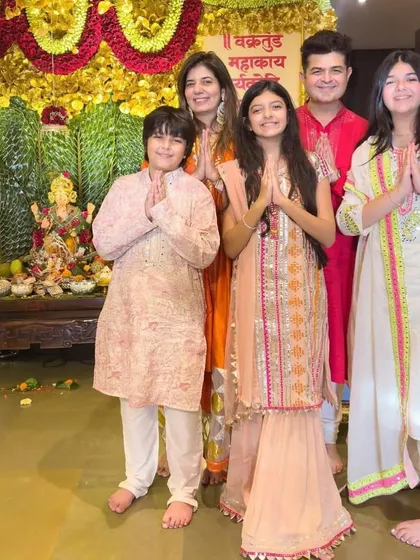 A beautiful shot of the Ratnani family offering prayers during Ganesh Chaturthi, with the children looking lovely in my custom festive outfits.