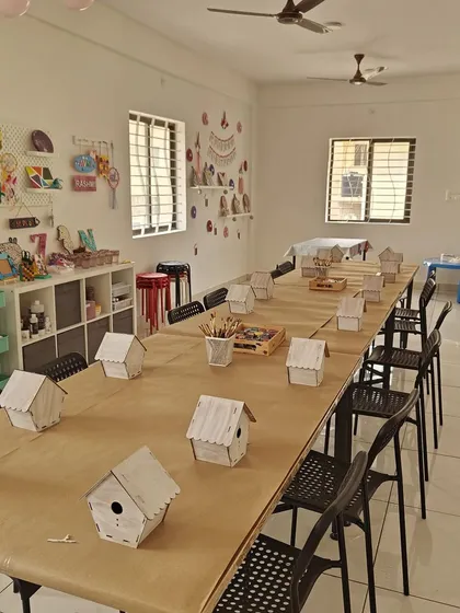 The calm before the creative storm! Our studio is prepped with individual birdhouse kits, ready for a fun-filled birthday party where every child gets to be an artist.