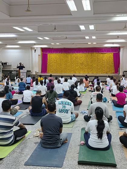 A wide shot of the hall during our International Yoga Day event. It's a powerful sight to see so many mats laid out, with everyone facing forward to share in the practice and teachings.