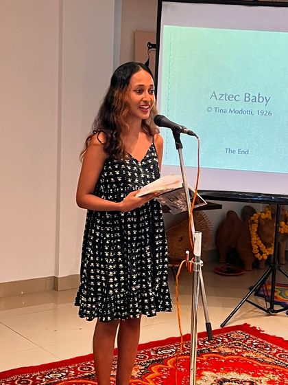 A young reader presenting at our event for the book 'The Celebration of Breastfeeding'. We encourage participation from all age groups in these important discussions.