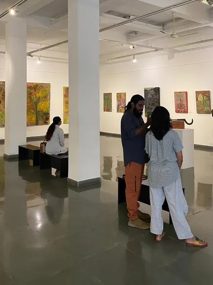 Visitors at the exhibition 'ME, AMMA, WE', a joint show by artist Unnikrishnan C and his mother, Devu Nenmara. The curation placed their distinct yet connected works in direct conversation.