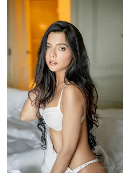Looking at you. A soft and alluring bedroom portrait of Ruhi Singh, using the morning light to create a gentle and intimate atmosphere.