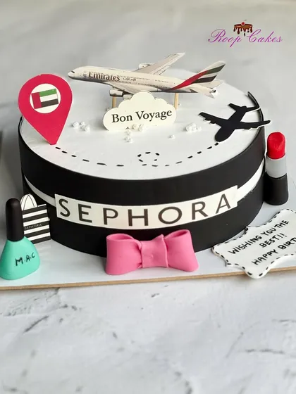 A perfect birthday cake for a girl who loves makeup and travel, featuring Sephora and MAC branding alongside an Emirates airplane.