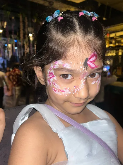 A full butterfly and flower design that covers one side of the face. This is a popular request at butterfly-themed birthday parties, and it always looks so adorable.