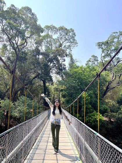Feeling free and joyful while crossing the hanging bridge at Kaveri Nisargadhama Forest Park in Coorg. Adventures like these are what make travel so enriching.