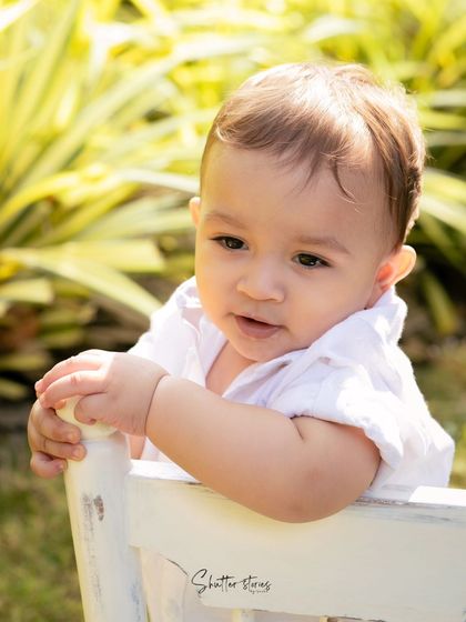 A handsome portrait of the baby boy before his splash session, enjoying the outdoors.