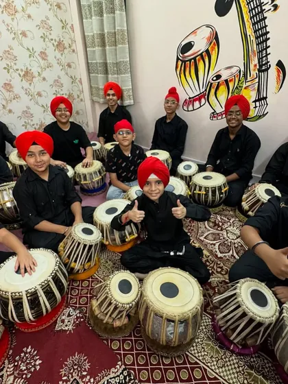 The team is ready! My students give a thumbs up before a group performance, all dressed in matching black kurtas.