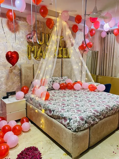 A balanced view of the pink and red themed first night decoration, showing how the elements fill the space without feeling cluttered.