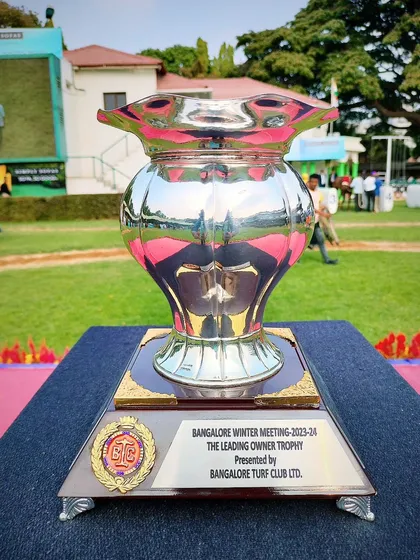 The Leading Owner Trophy, a classic silver vase design.