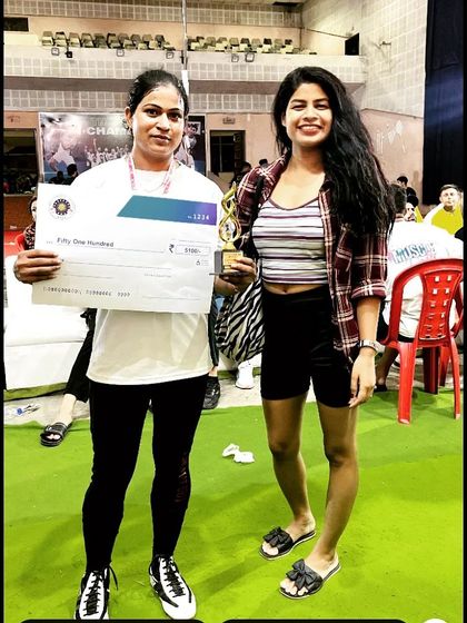 Posing with a fellow competitor and her prize. Supporting other women in the sport is important to me.